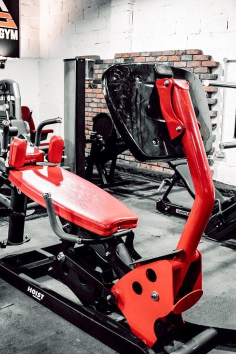 Leg press painted in black and red